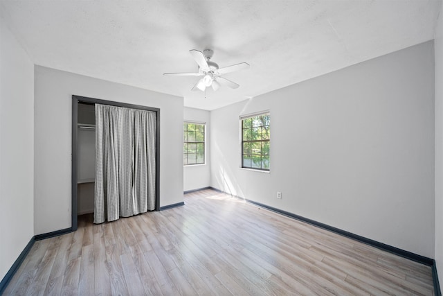 2401 Hideaway Ct, Tallahassee, FL 32303 - unfurnished bedroom with baseboards, a ceiling fan, wood finished floors, and a closet