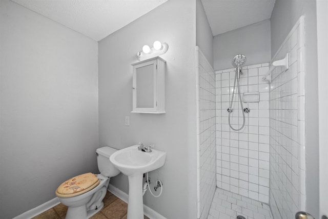 2401 Hideaway Ct, Tallahassee, FL 32303 - bathroom with a shower stall, toilet, baseboards, and tile patterned floors