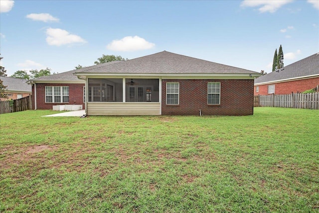 5127 Wild Rose Way, Tallahassee, FL 32312 - back of property with ceiling fan, brick siding, a fenced backyard, a sunroom, and roof with shingles