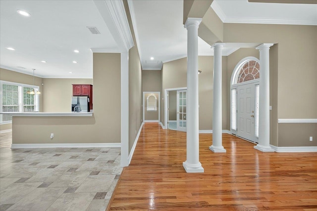 5127 Wild Rose Way, Tallahassee, FL 32312 - entryway featuring crown molding, recessed lighting, ornate columns, and light wood-type flooring