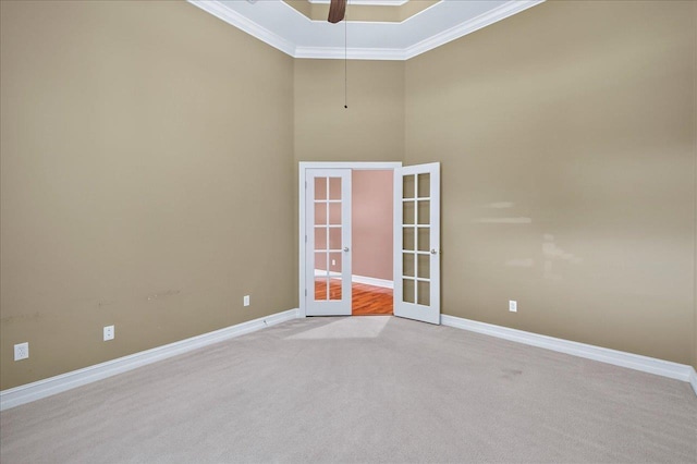 5127 Wild Rose Way, Tallahassee, FL 32312 - spare room featuring ornamental molding, french doors, carpet floors, ceiling fan, and a high ceiling