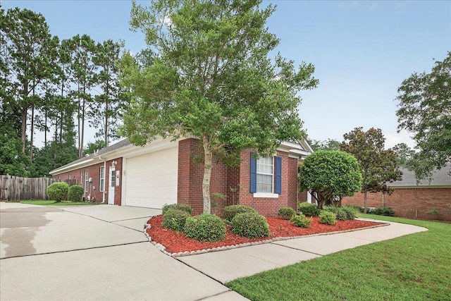 5127 Wild Rose Way, Tallahassee, FL 32312 - view of front of house with an attached garage, driveway, and brick siding