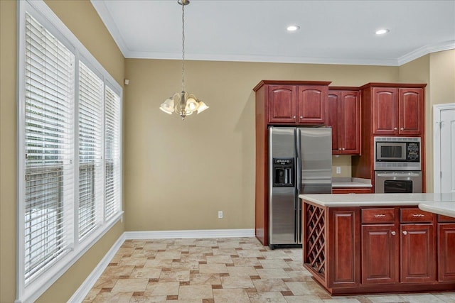5127 Wild Rose Way, Tallahassee, FL 32312 - kitchen with stainless steel appliances, a chandelier, light countertops, reddish brown cabinets, and crown molding