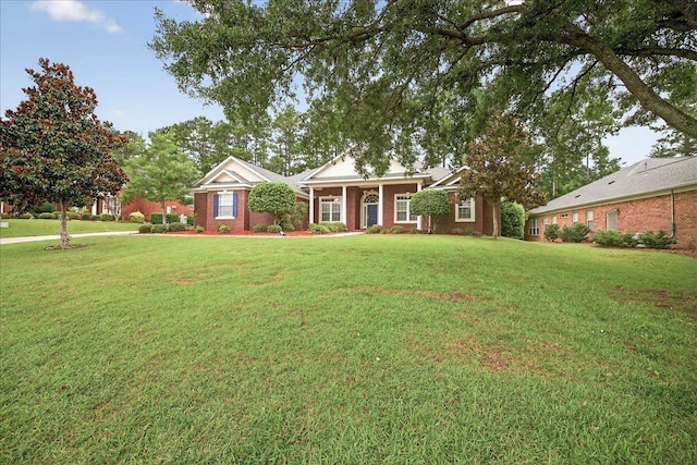 5127 Wild Rose Way, Tallahassee, FL 32312 - view of front of house featuring a front yard and brick siding