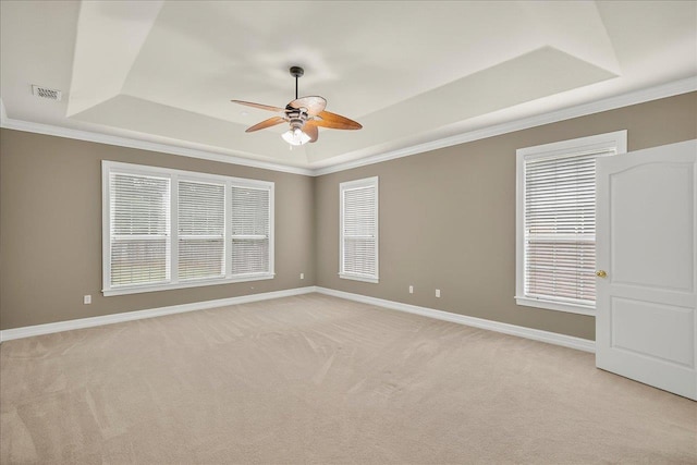 5127 Wild Rose Way, Tallahassee, FL 32312 - spare room featuring a tray ceiling, ceiling fan, light carpet, and crown molding