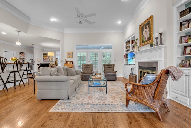 8555 Congressional Dr, Tallahassee, FL 32312 - living area with ornamental molding, ceiling fan, light wood finished floors, recessed lighting, and built in shelves