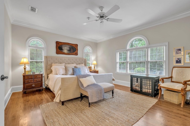 8555 Congressional Dr, Tallahassee, FL 32312 - bedroom with ornamental molding, multiple windows, wood finished floors, baseboards, and a ceiling fan