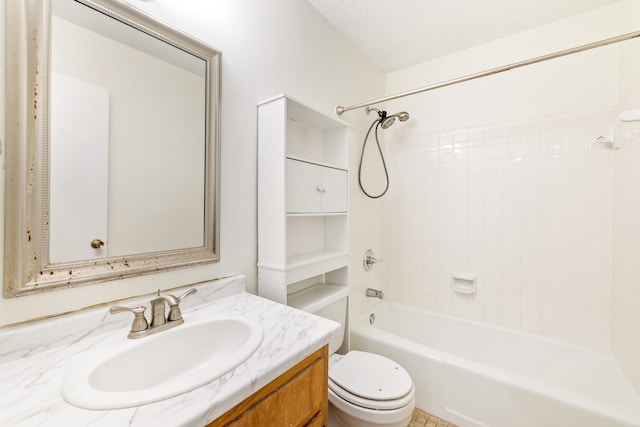 full bathroom with shower / bathing tub combination, vanity, a textured ceiling, and toilet