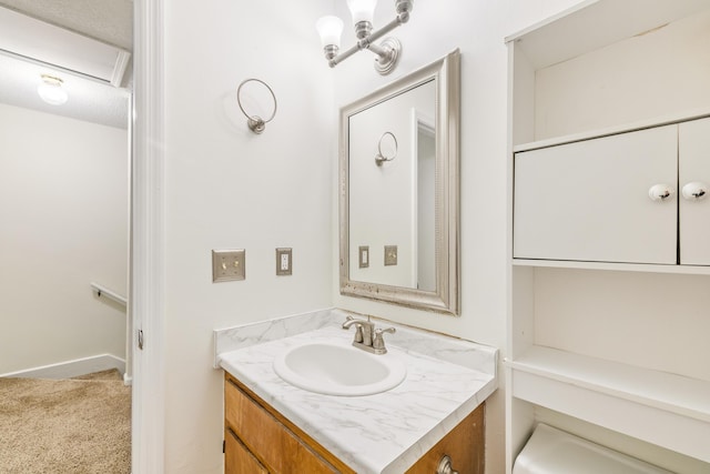 bathroom featuring vanity and a textured ceiling