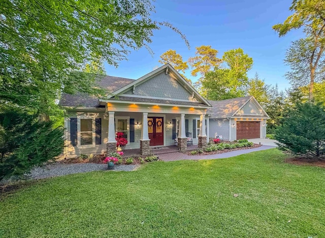 craftsman-style home featuring an attached garage, stone siding, a front lawn, and a porch