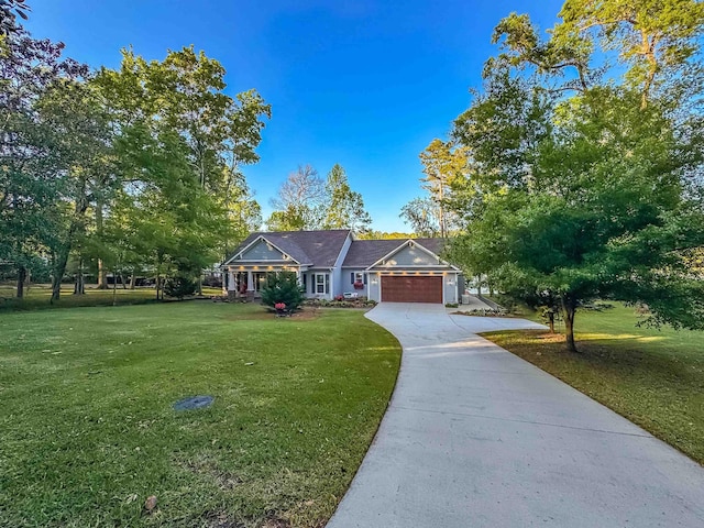 ranch-style home with concrete driveway, a front yard, and an attached garage