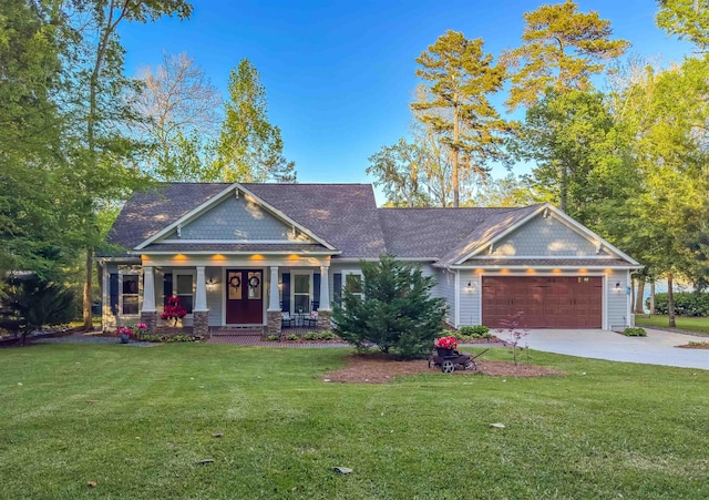 view of front of home featuring a garage, a porch, a front yard, a shingled roof, and driveway