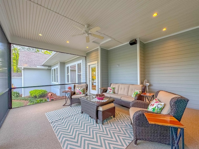 sunroom / solarium with a ceiling fan and an outdoor hangout area