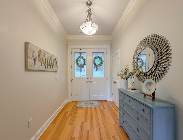 foyer with light wood-type flooring, french doors, baseboards, and ornamental molding