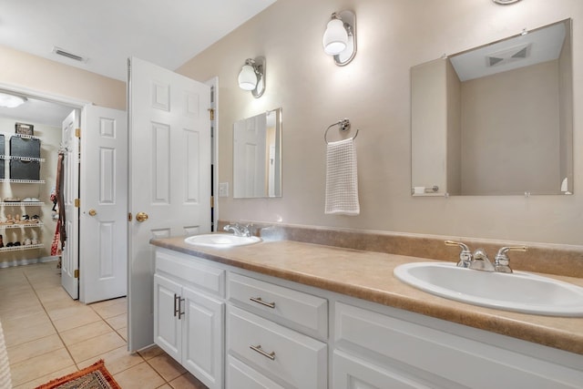 bathroom with vanity and tile patterned floors