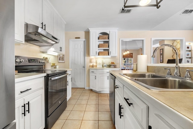 kitchen with white cabinets, stainless steel appliances, light tile patterned flooring, and sink