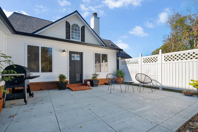 rear view of house with a patio