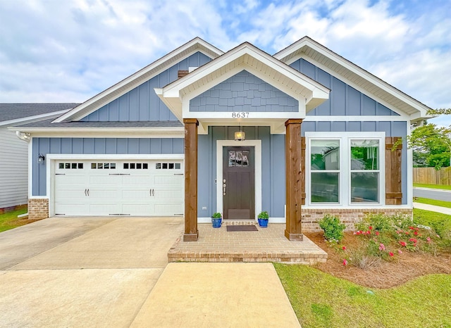 8637 Brooklin Pl, Tallahassee, FL 32312 - craftsman inspired home with concrete driveway, roof with shingles, board and batten siding, an attached garage, and brick siding
