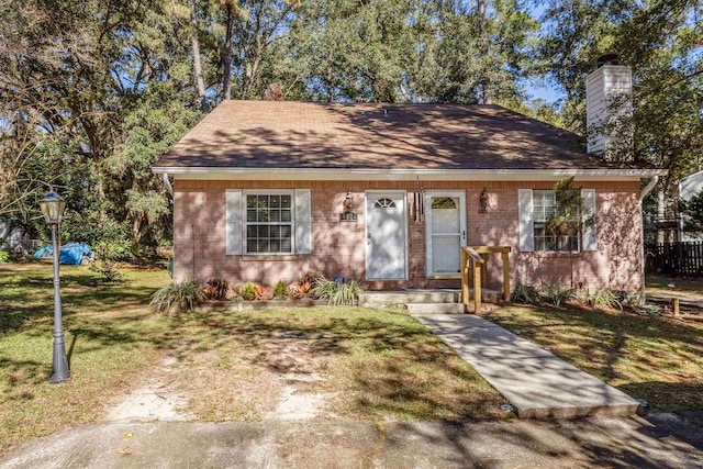 view of front of home with a front yard