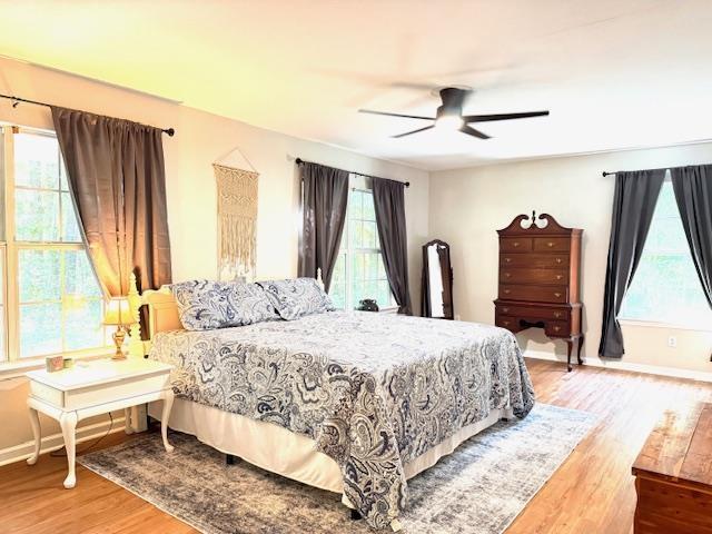 415 Hunters Trce, Crawfordville, FL 32327 - bedroom featuring wood finished floors and ceiling fan
