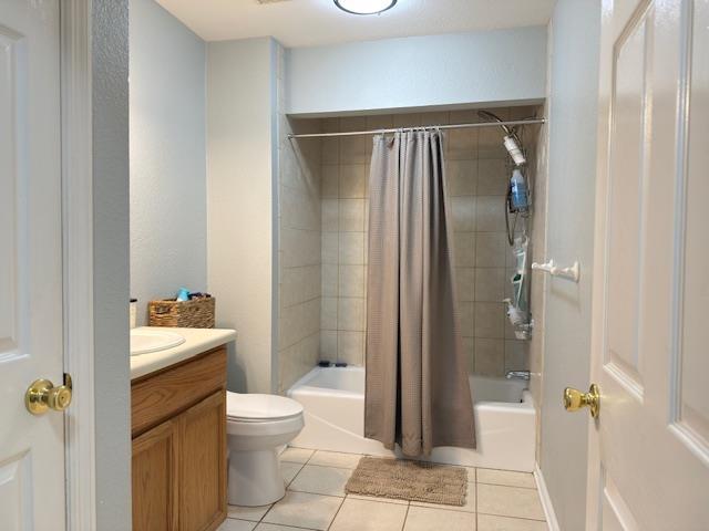 415 Hunters Trce, Crawfordville, FL 32327 - full bathroom featuring vanity, shower / bath combination with curtain, and tile patterned flooring