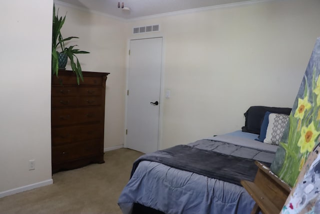 bedroom featuring light carpet and ornamental molding