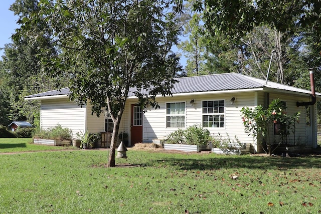 ranch-style home with a front lawn