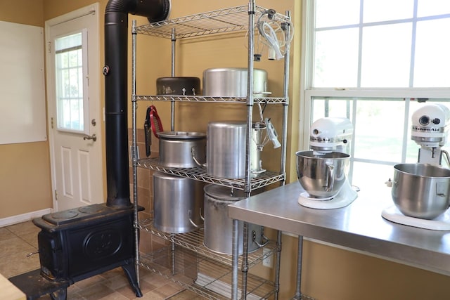 kitchen featuring tile patterned floors and stainless steel counters