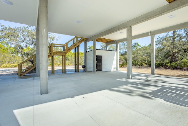 view of patio with a storage unit