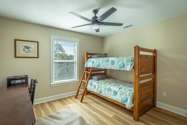 bedroom with ceiling fan and light wood-type flooring