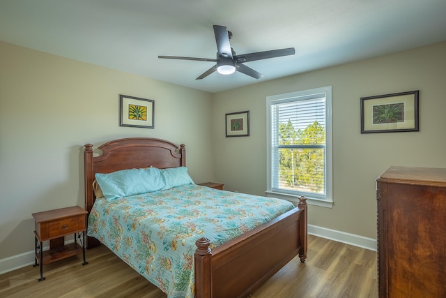 bedroom featuring ceiling fan and light wood-type flooring