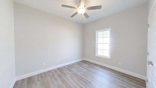 1009 Syrup Mill Creek Ln, Cairo, GA 39828 - empty room with baseboards, wood finished floors, and a ceiling fan
