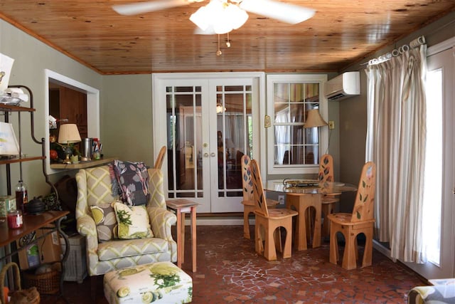 sitting room with wooden ceiling, plenty of natural light, an AC wall unit, and french doors