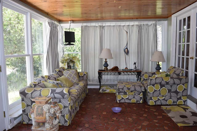 sunroom featuring wooden ceiling