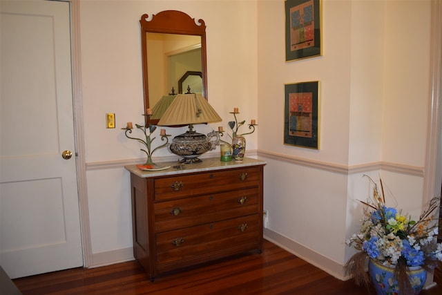 corridor featuring dark hardwood / wood-style floors