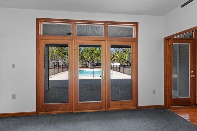 doorway to outside featuring wood-type flooring