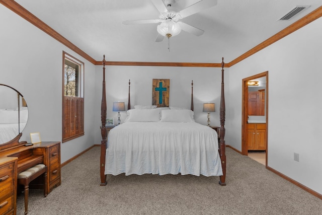 bedroom with ceiling fan, ensuite bath, crown molding, and light colored carpet