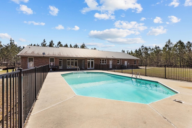 view of swimming pool with a patio