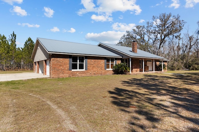 ranch-style house featuring a garage and a front yard