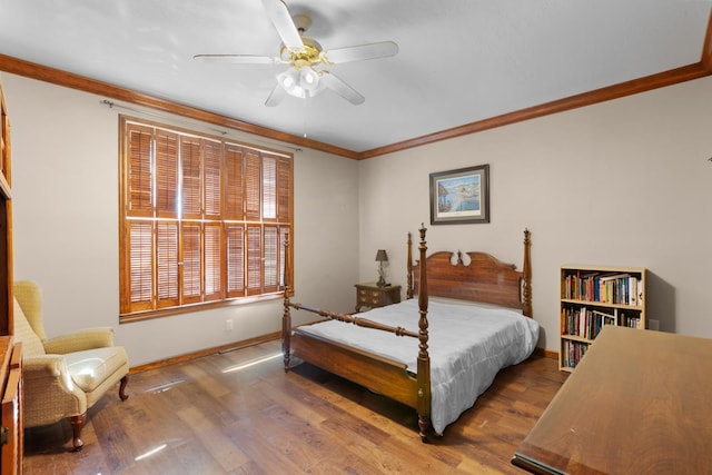 bedroom featuring ornamental molding, hardwood / wood-style floors, and ceiling fan