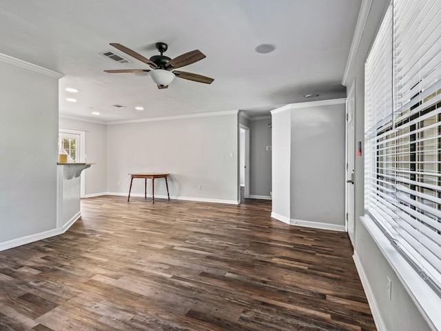 unfurnished living room with dark hardwood / wood-style floors, ceiling fan, and ornamental molding