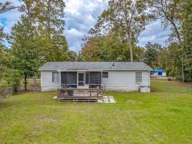 back of house with a yard and a deck