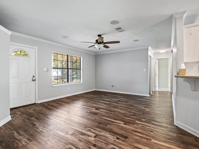 unfurnished living room with ceiling fan, crown molding, and dark wood-type flooring