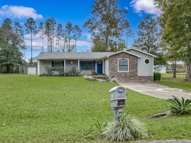 ranch-style house featuring a carport and a front yard