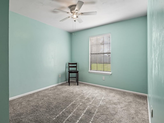 spare room with carpet flooring and ceiling fan