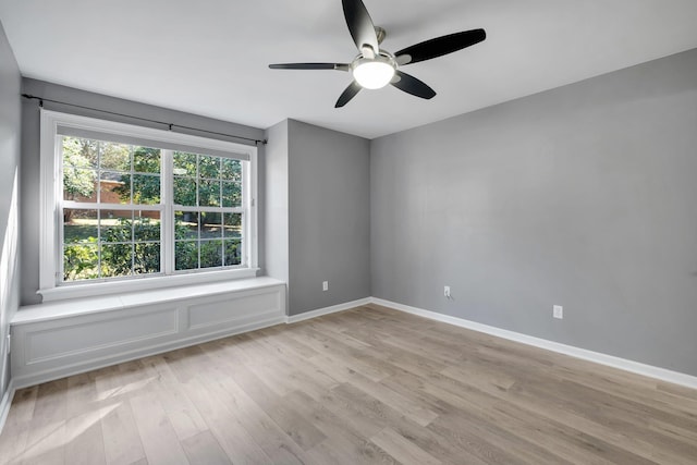 unfurnished room with ceiling fan and light wood-type flooring