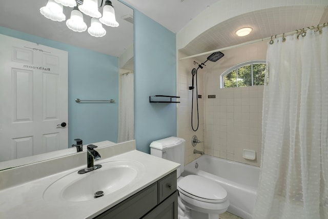 full bathroom featuring shower / bathtub combination with curtain, vanity, and toilet