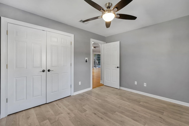 unfurnished bedroom with a closet, ceiling fan, and light hardwood / wood-style flooring