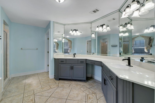 bathroom featuring vanity, tile patterned floors, and a shower with shower door