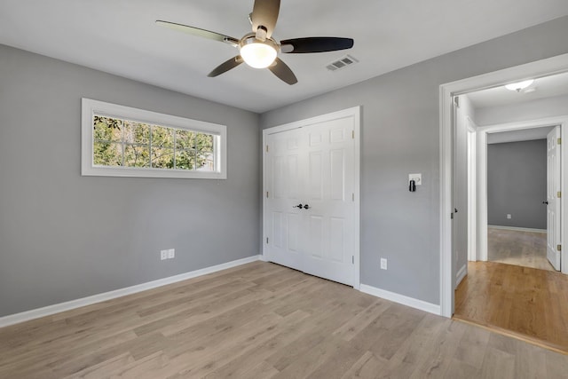 unfurnished bedroom with a closet, ceiling fan, and light hardwood / wood-style flooring